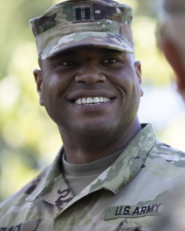 African-America male soldier in uniform smiling